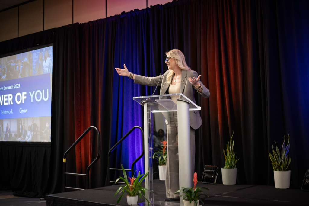 Harmony Vallejo, keynote speaker and founder of Universal Events Inc., delivering a speech at a national leadership conference